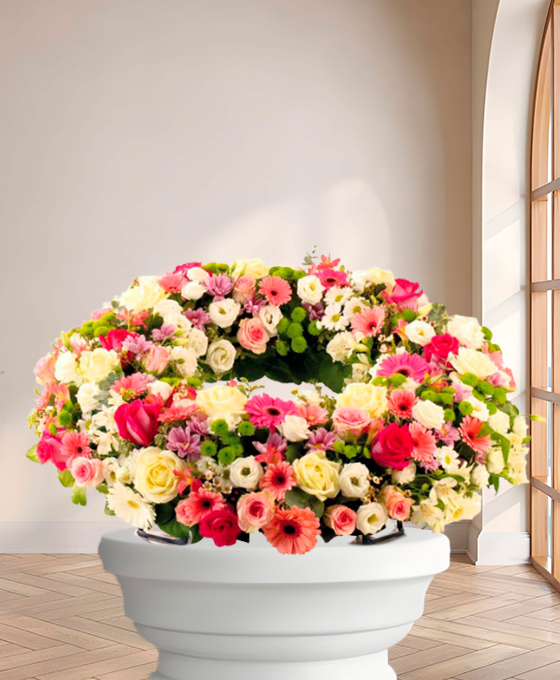 Couronne Solennelle — fleurs de deuil livrees a Paris