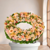 Couronne Tradition — fleurs de deuil livrees a Paris